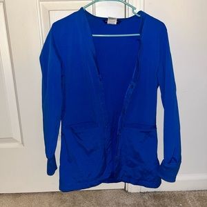 BRAND NEW royal blue scrub jacket. Size small.